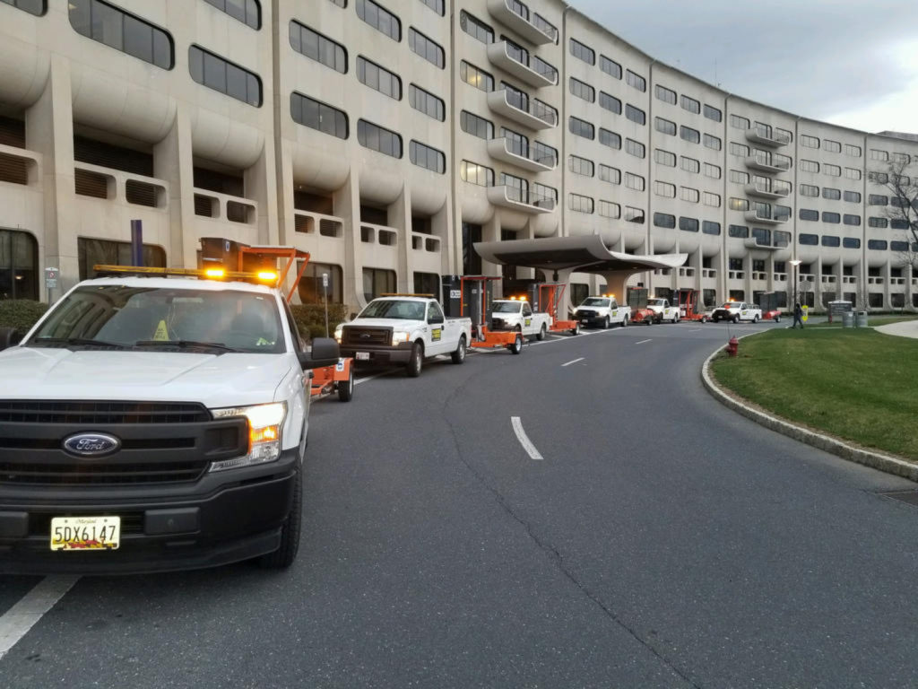 Flagger Force trucks lined up outside of a medical building to support COVID-19 communications with the traveling public.