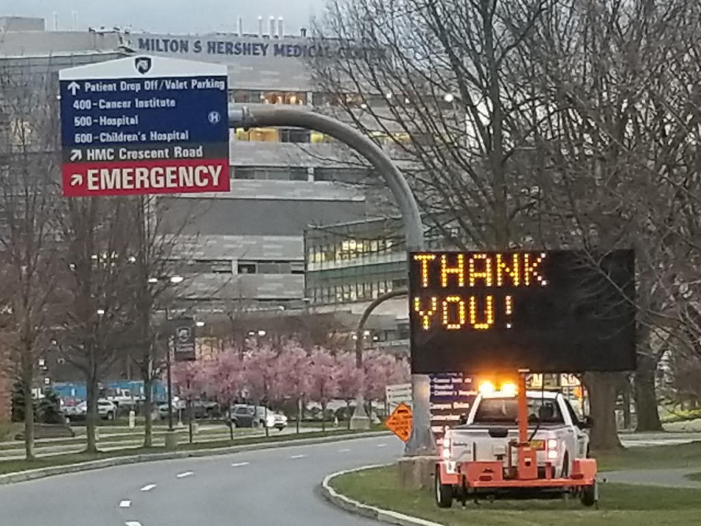 Flagger Force truck and message board outside of a medical building to support COVID-19 communications with the traveling public.