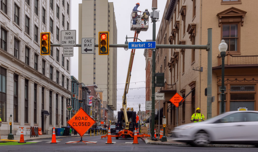 Work zone in Harrisburg, PA city with road closed signage