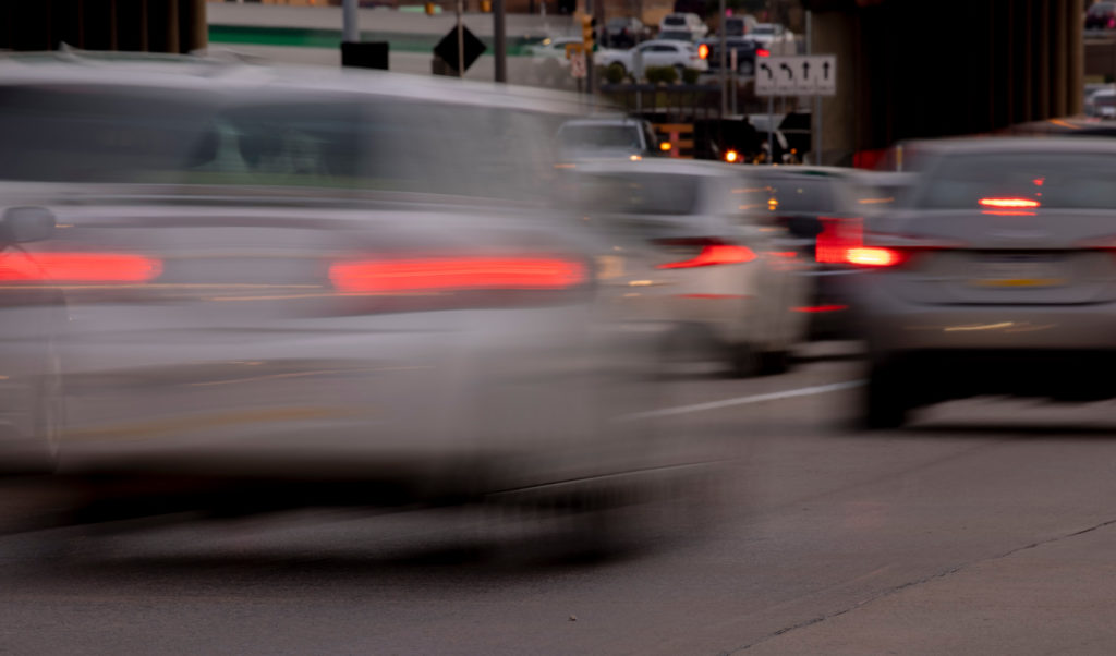 Cars in traffic driving/speeding