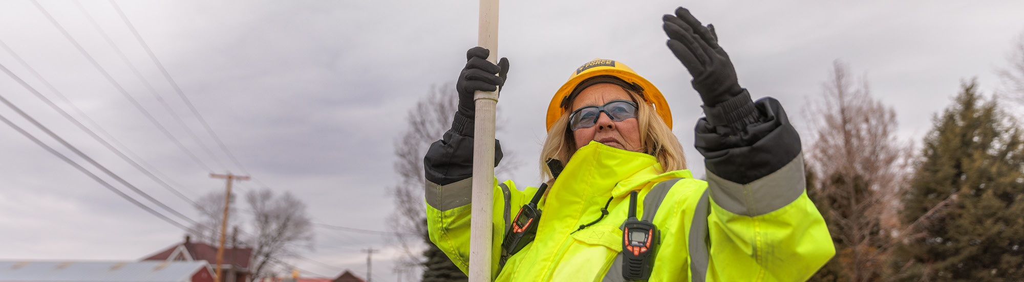woman flagger waving traffic through