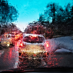Car stuck in traffic in bad weather