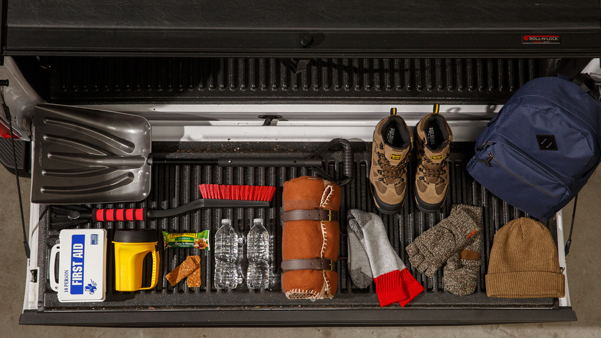 Emergency preparedness items laid out on tailgate