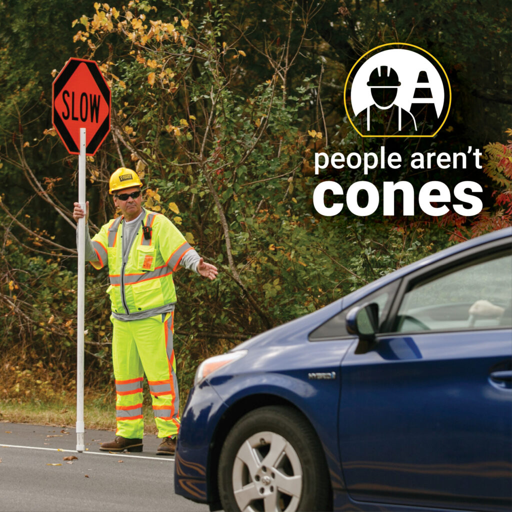 People Aren't Cones - Flagger in yellow PPE